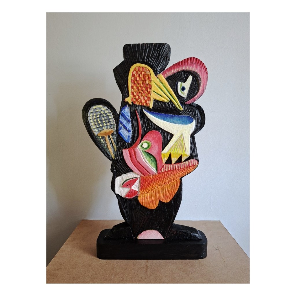 a colourful wood sculpture that brings colour and design to a space. A conversation piece and bold statement.